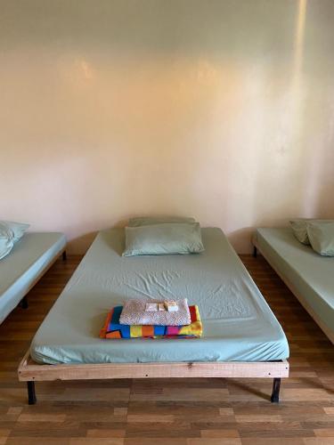 a bed in a room with two mattresses at Location One Eighty in Bangcusay