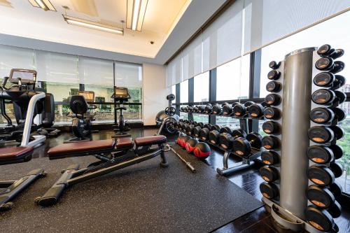 a fitness room with a gym with tread machines at Hyatt Regency Manila City of Dreams in Manila