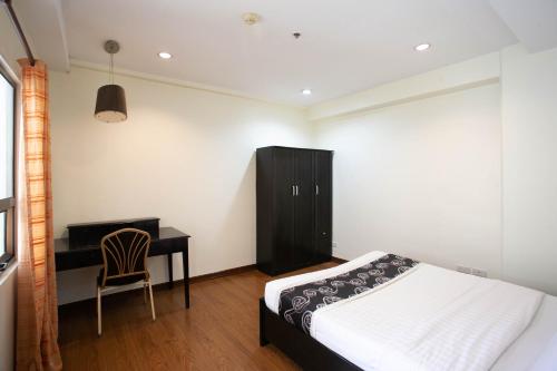 Ένα ή περισσότερα κρεβάτια σε δωμάτιο στο Diamond Suites and Residences