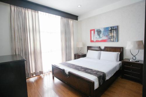 Ένα ή περισσότερα κρεβάτια σε δωμάτιο στο Diamond Suites and Residences