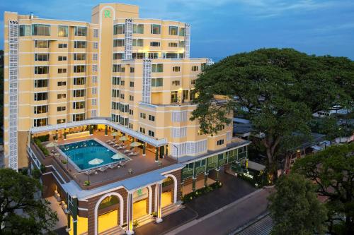 an overhead view of a building with a swimming pool at The Raintree Hotel Chiang Mai in Chiang Mai