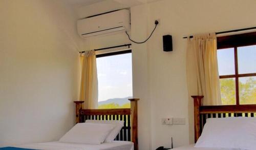 Ένα ή περισσότερα κρεβάτια σε δωμάτιο στο Green villa yala