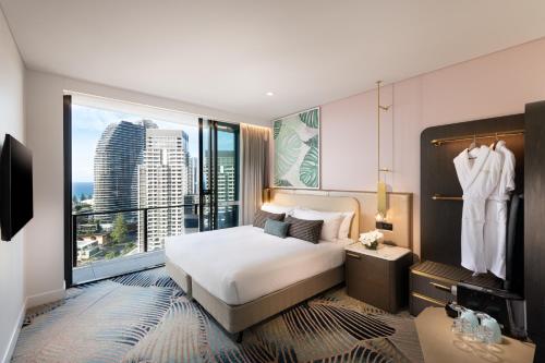 a hotel room with a bed and a large window at Dorsett Gold Coast in Gold Coast