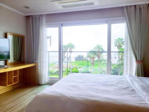 Postel nebo postele na pokoji v ubytování Dombe Resort