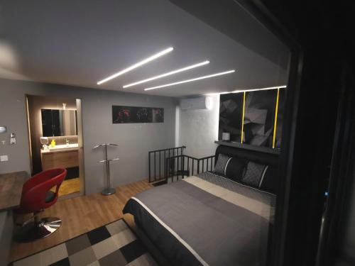 a bedroom with a bed and a desk and a chair at Villa46 in Pécs