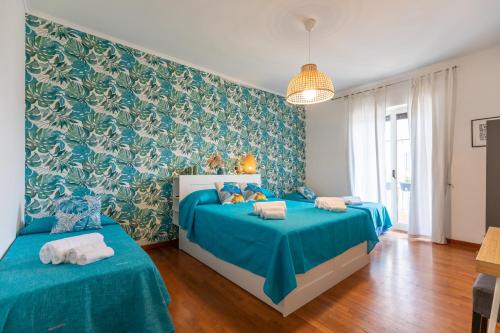 Кровать или кровати в номере Salotto Napoletano 381