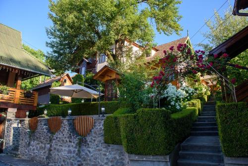 a stairway leading to a house with a garden at Casa Edy in Sovata