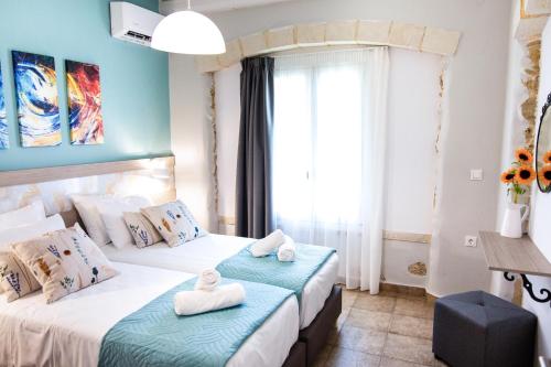 Postel nebo postele na pokoji v ubytování Sonio Villas - Que Bella Collection