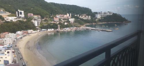 a view of a beach with buildings and a city at Ocean View in Geoje 