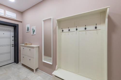 a bathroom with a shower and a mirror at Great Location Apartment in Varna City