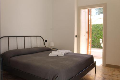 Posteľ alebo postele v izbe v ubytovaní San Leone Home