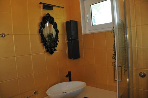 A bathroom at Olive Tree Apartment