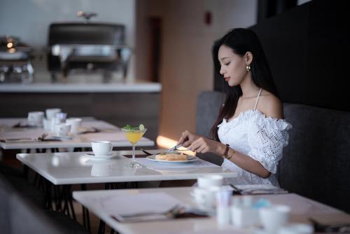 Gæster der bor på Draco Hotel & Suites