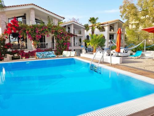 a large swimming pool in front of a house at Perikleshills in Thermisía