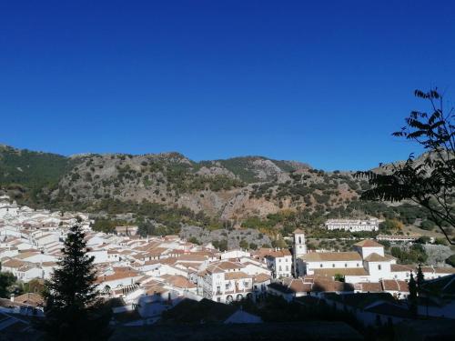 a view of a town with a mountain in the background at Casas Las Piedras de Agua in Grazalema