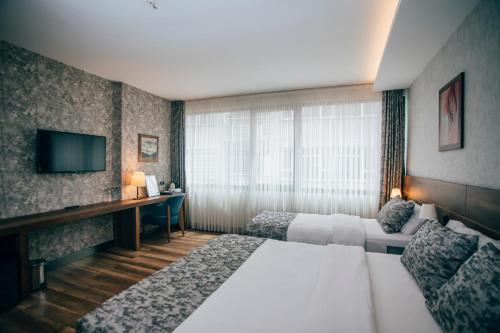 Кровать или кровати в номере Life Point Hotel