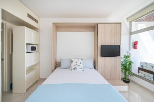 Ένα ή περισσότερα κρεβάτια σε δωμάτιο στο DreamView Studio by Encantos do Algarve - 1713