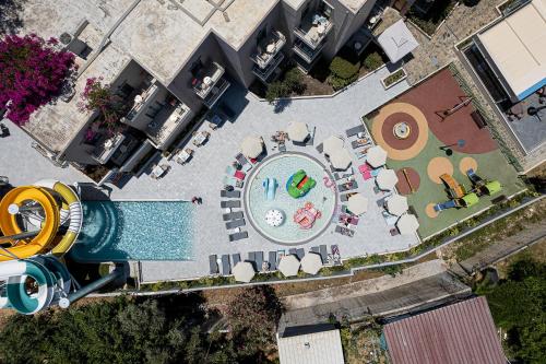 an overhead view of a swimming pool with a pool at Porto Platanias Beach Luxury Selection - Adults Only in Plataniás