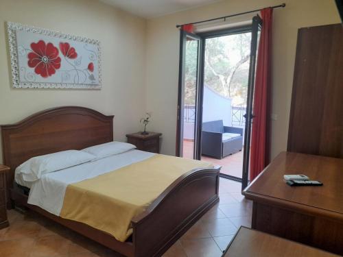 Ένα ή περισσότερα κρεβάτια σε δωμάτιο στο B&B Il Giardino di Zefiro