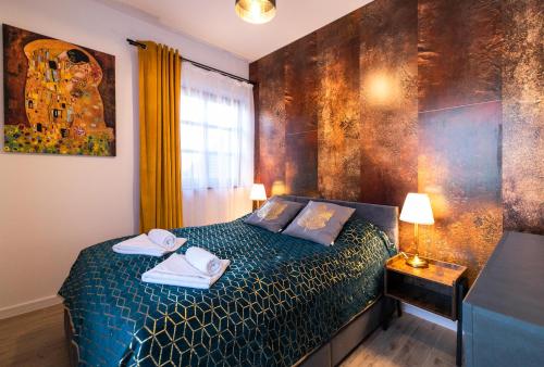 Ένα ή περισσότερα κρεβάτια σε δωμάτιο στο Apartament Liściasty 1 z tarasem - Dream Apart