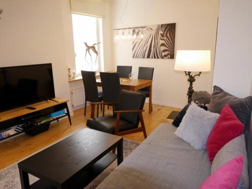 a living room with a couch and a table at Ferienwohnung Munich in Traben-Trarbach