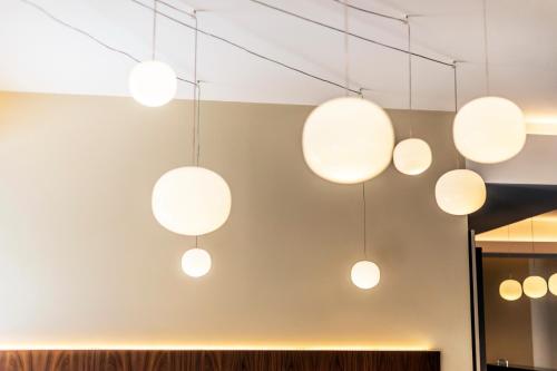 a group of lights hanging from the ceiling at Solmaris Tropea Rooms & Suites in Tropea