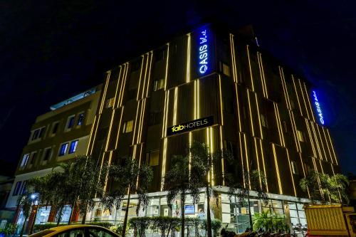 a building with a sign on the front of it at FabHotel Prime Oasis Blue in Bhopal