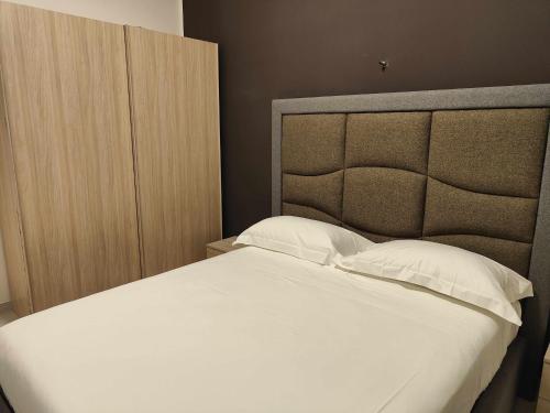 A bed or beds in a room at Fantasia B&B APARTAMENT STUDIO
