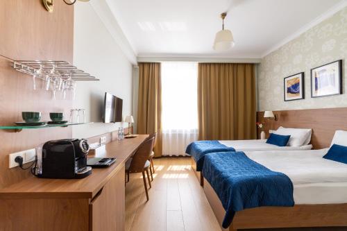 Кровать или кровати в номере Portal House Apartments