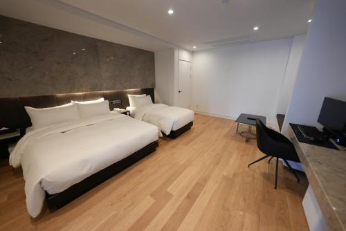 Ένα ή περισσότερα κρεβάτια σε δωμάτιο στο Amare Hotel Jongno