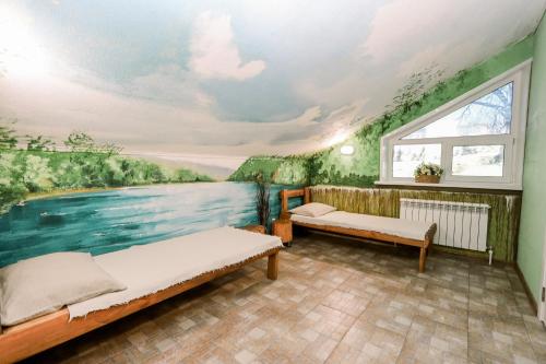 a bedroom with a mural of a river at Гостевой дом "Barkhat" in Izhevsk