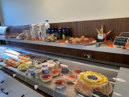 a buffet line with food on display in a restaurant at Solmaris Tropea Rooms & Suites in Tropea