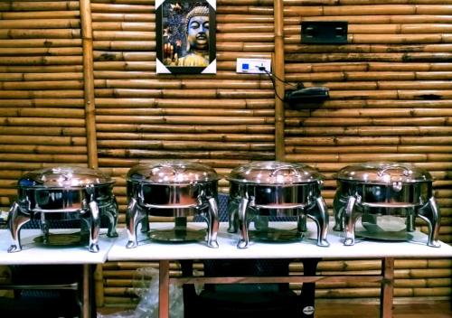 three drums on a table in a room at Bamboo Junction Resort - Kanatal, Valley & Mountain View in Dhanaulti