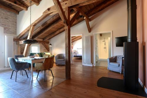 a living room with a table and chairs at Storchenhof Blumenow in Blumenow