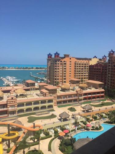 an aerial view of a city with a resort at فندق بورتو مارينا - غرفة فندقية بخدمة فندقية in El Alamein