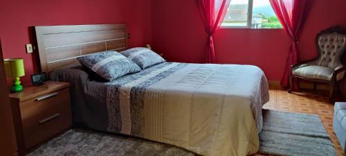 a bedroom with a bed and a dresser and a window at Villa Blas - Camiño Portugués- in Redondela