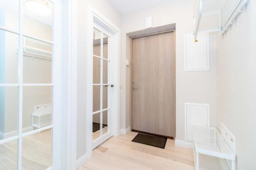 a hallway with a closet and a door at Seagulls&Dunes APTw/terrace, 2min to the Beach, by Cohost in Klaipėda