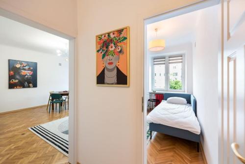 Posteľ alebo postele v izbe v ubytovaní Metro Plac Wilsona Etno Apartament