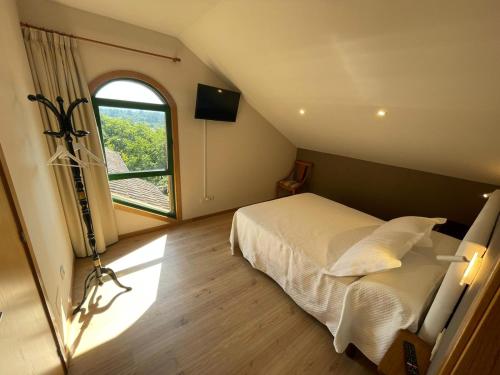 Postel nebo postele na pokoji v ubytování Casa y Apartamento Rural Terra Celta en Salceda de Caselas