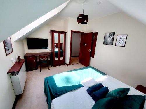 Una cama o camas en una habitación de Forrest style Pokoje gościnne