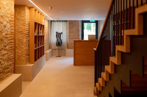 a hallway of a house with a horse head on the wall at Château de Fiac - Luxurious Hôtel & Spa in Fiac