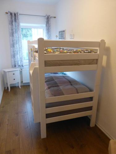 Postel nebo postele na pokoji v ubytování Ferienwohnung Jano - Residenz am See
