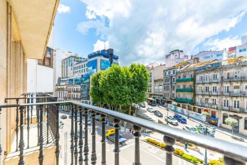 a view of a city street from a balcony at Hotel Atlántico Vigo in Vigo