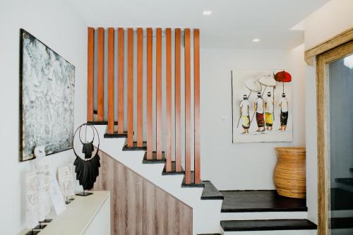 a staircase in a house with wooden railings at Bali Diamond Estates & Villas in Keramas