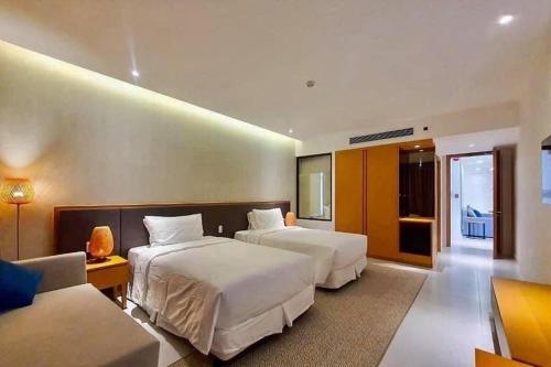 En eller flere senge i et værelse på Biêt thự trong Wyndham Garden Cam Ranh
