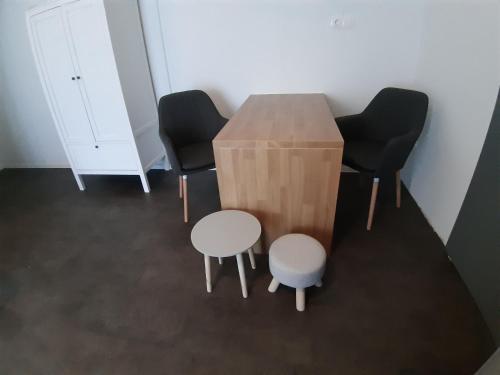 a table and four chairs in a room at MY WAY BB in Bag