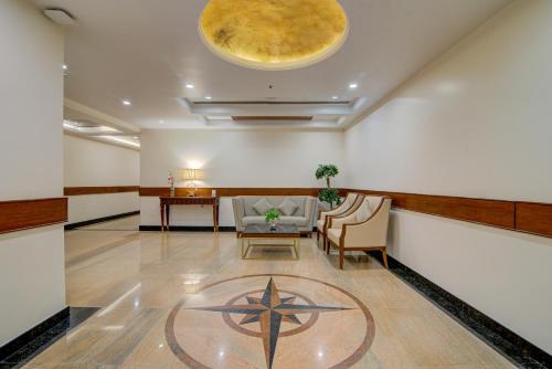 a lobby with a star on the floor at Hotel Home In By Amrik Sukhdev in Sonīpat