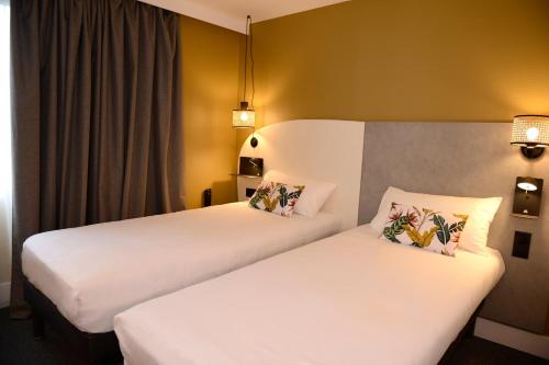 Hôtel Villa Berliozにあるベッド