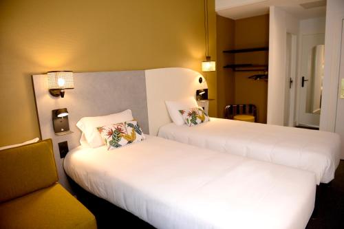 Hôtel Villa Berliozにあるベッド