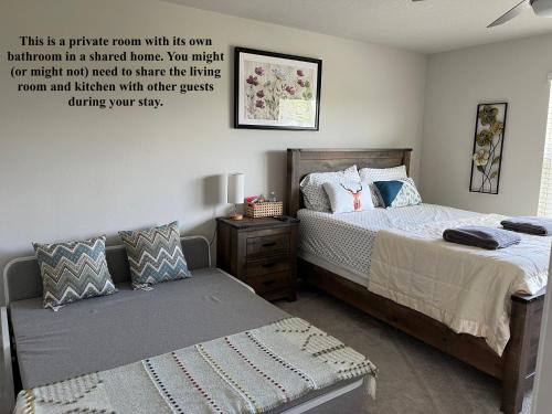a bedroom with two beds and a quote on the wall at ZenHomes in heart of Brandon convenient location in Brandon